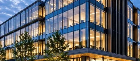 Modern glazed office building at dusk